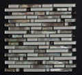 Glass mosaic tile pattern on a black background