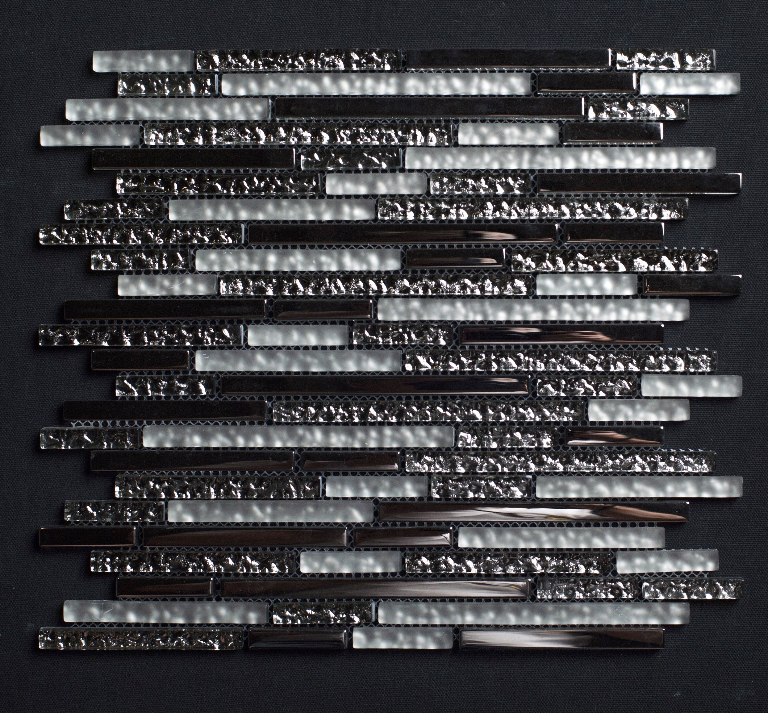 Glass mosaic tile pattern on a black background