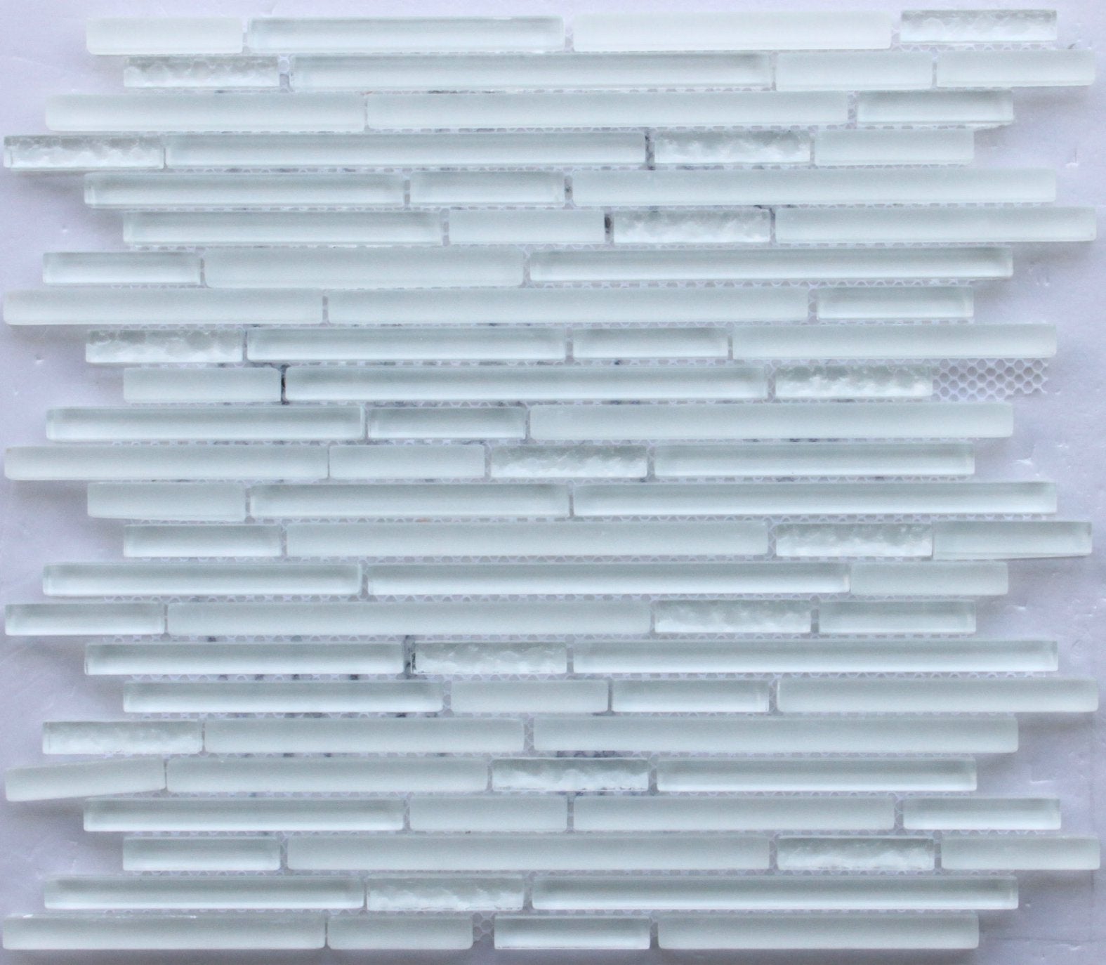 Mosaic tile pattern with horizontal strips on a white background
