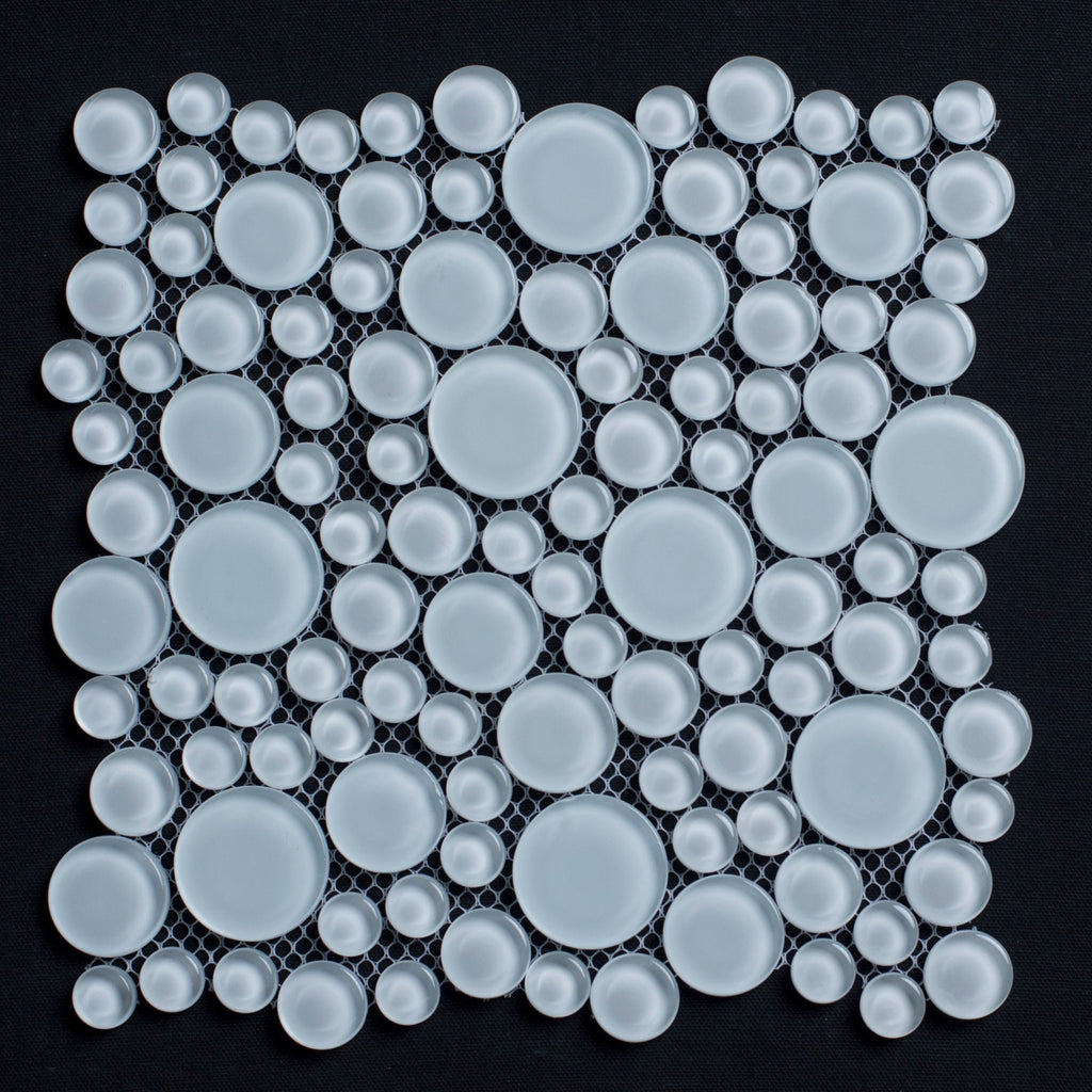 Mosaic pattern of white circular tiles