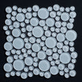 Mosaic pattern of white circular tiles