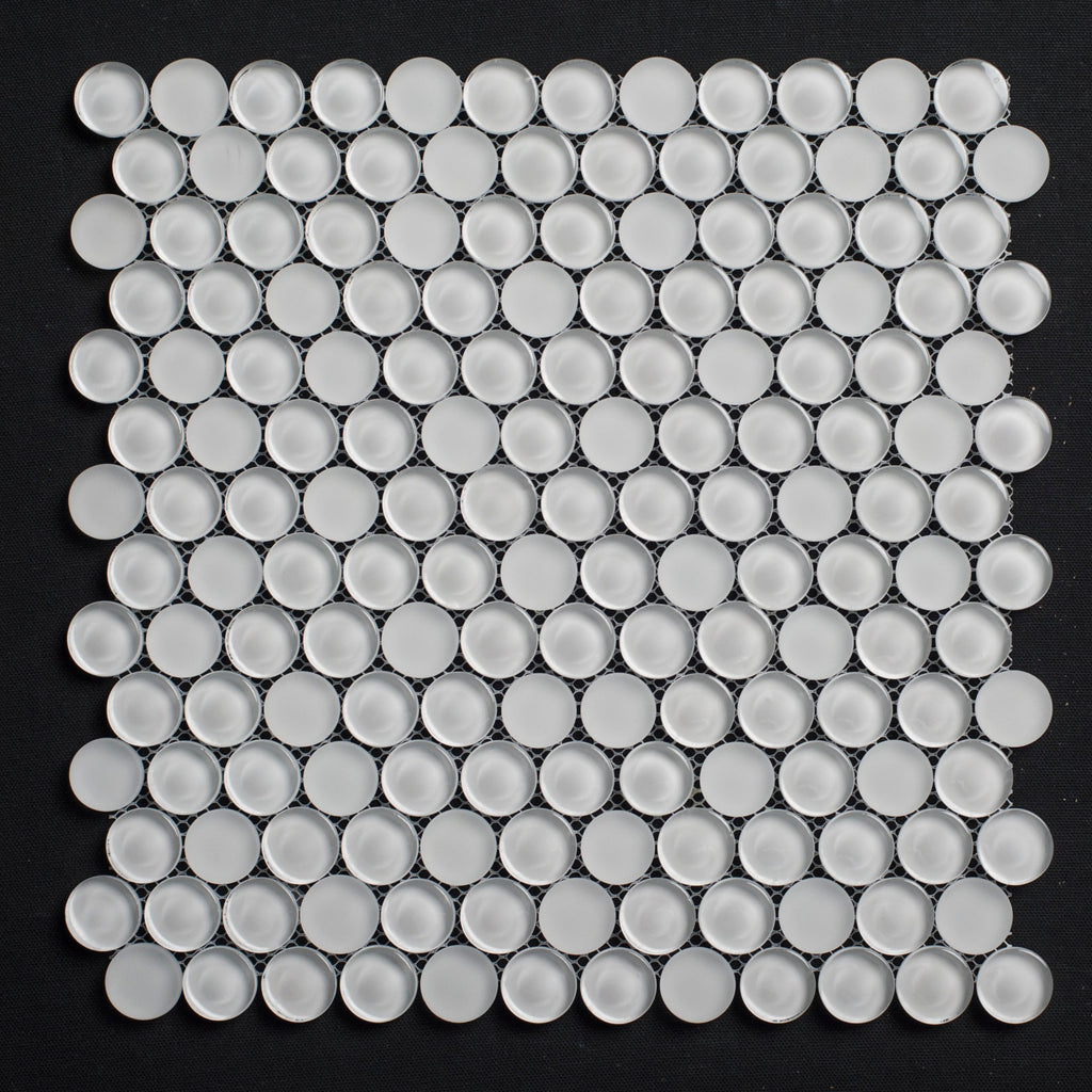 White circular tiles arranged in a grid pattern on a black background