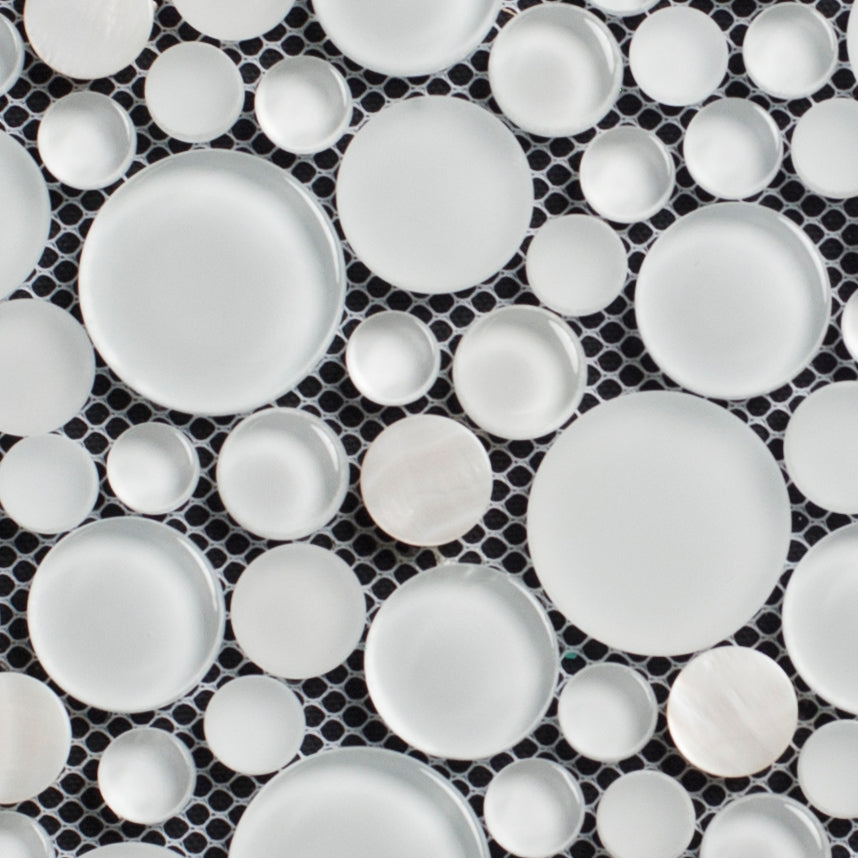 Pattern of white ceramic plates on a black geometric background