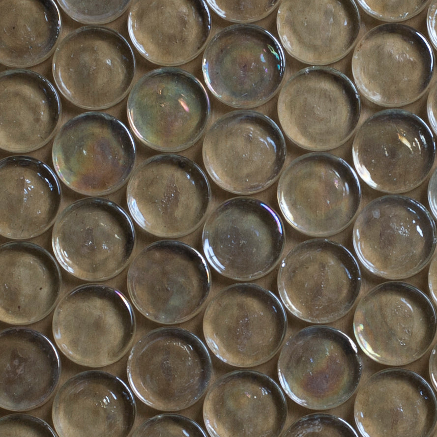 Close-up of glass mosaic tiles with a metallic sheen