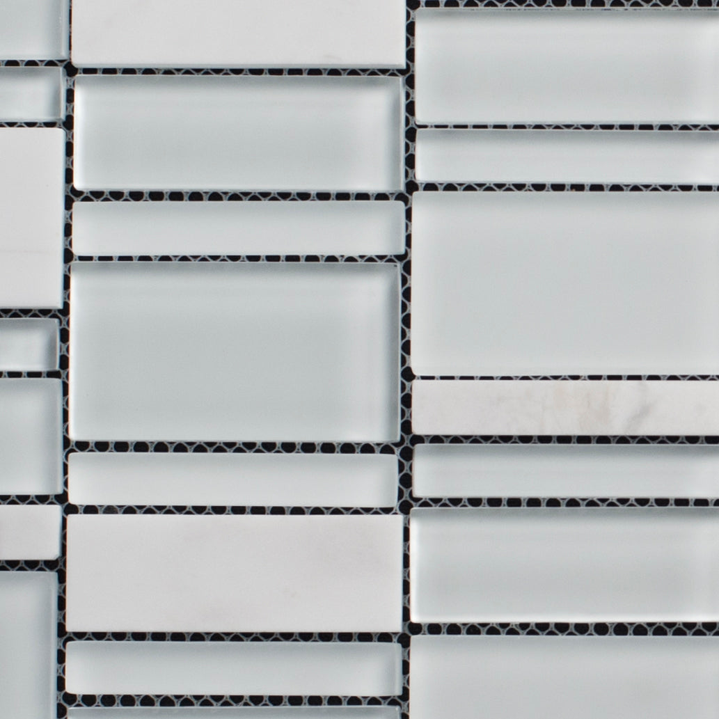 Close-up of a tiled wall with rectangular tiles in a grid pattern.
