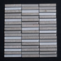Mosaic tile pattern with gray and white stripes on a black background