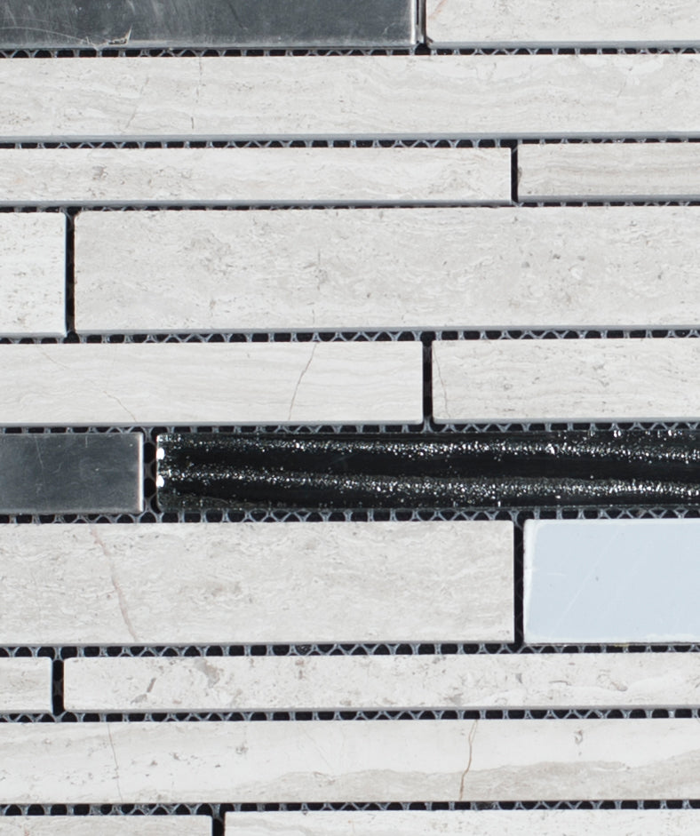 Close-up of a tiled wall with gray and black bricks