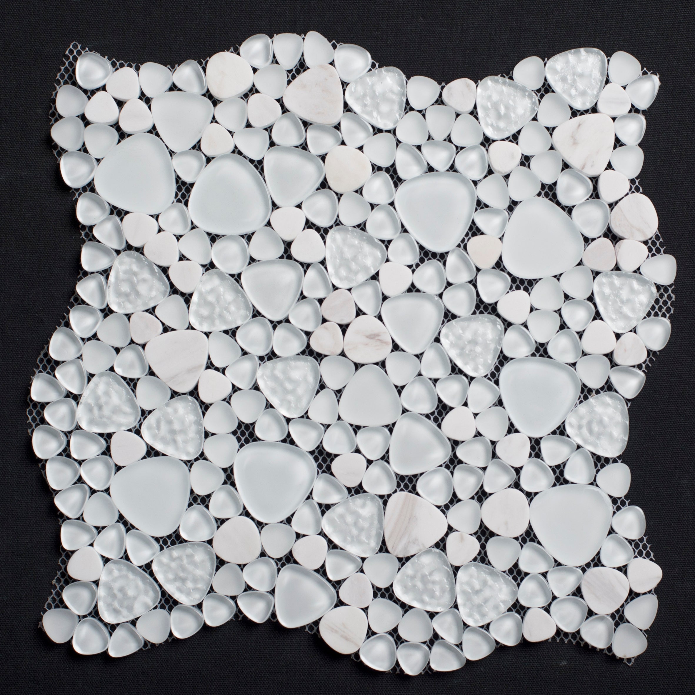 White pebble mosaic tile on a black background