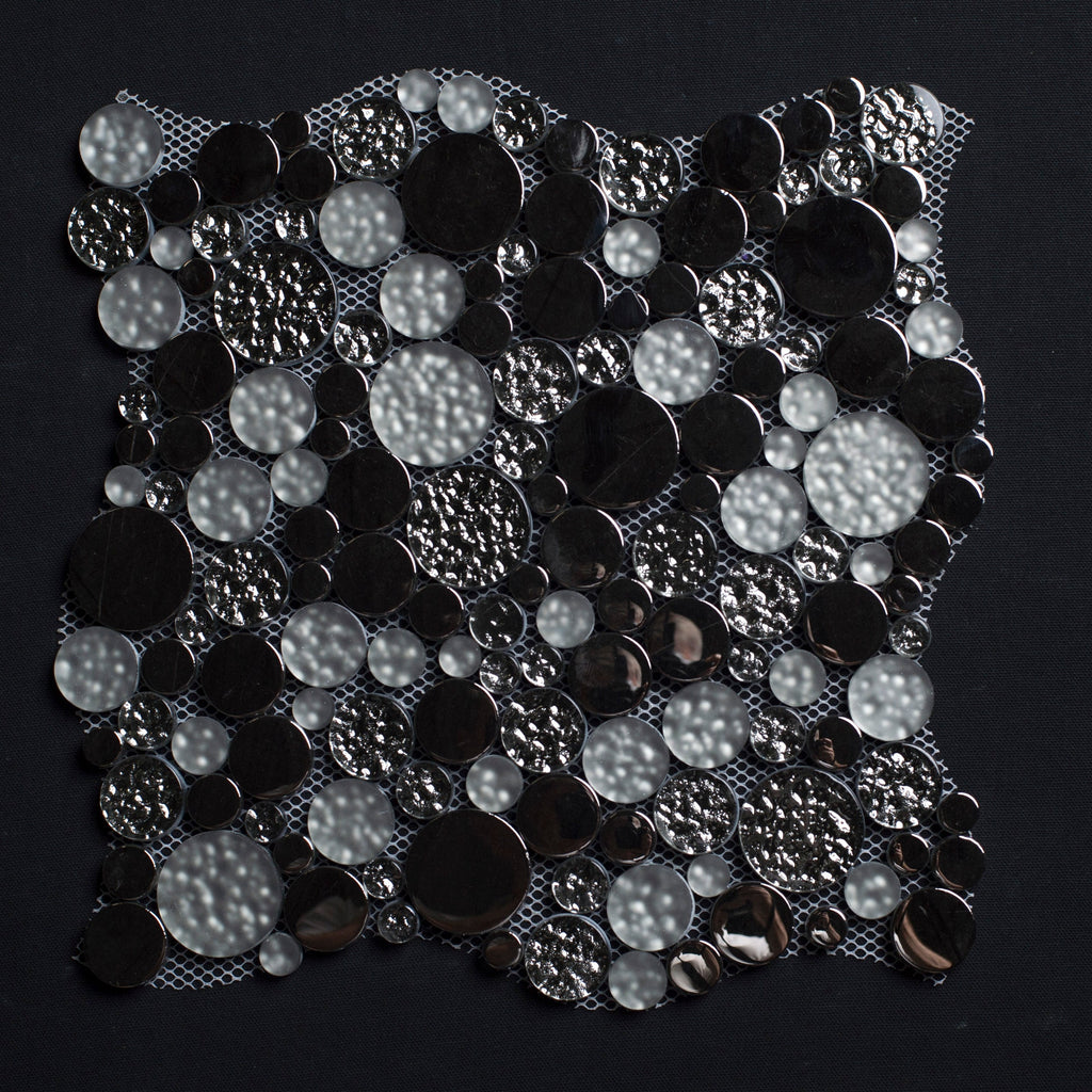 Black and silver sequin fabric on a black background