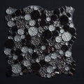 Black and silver sequin fabric on a black background