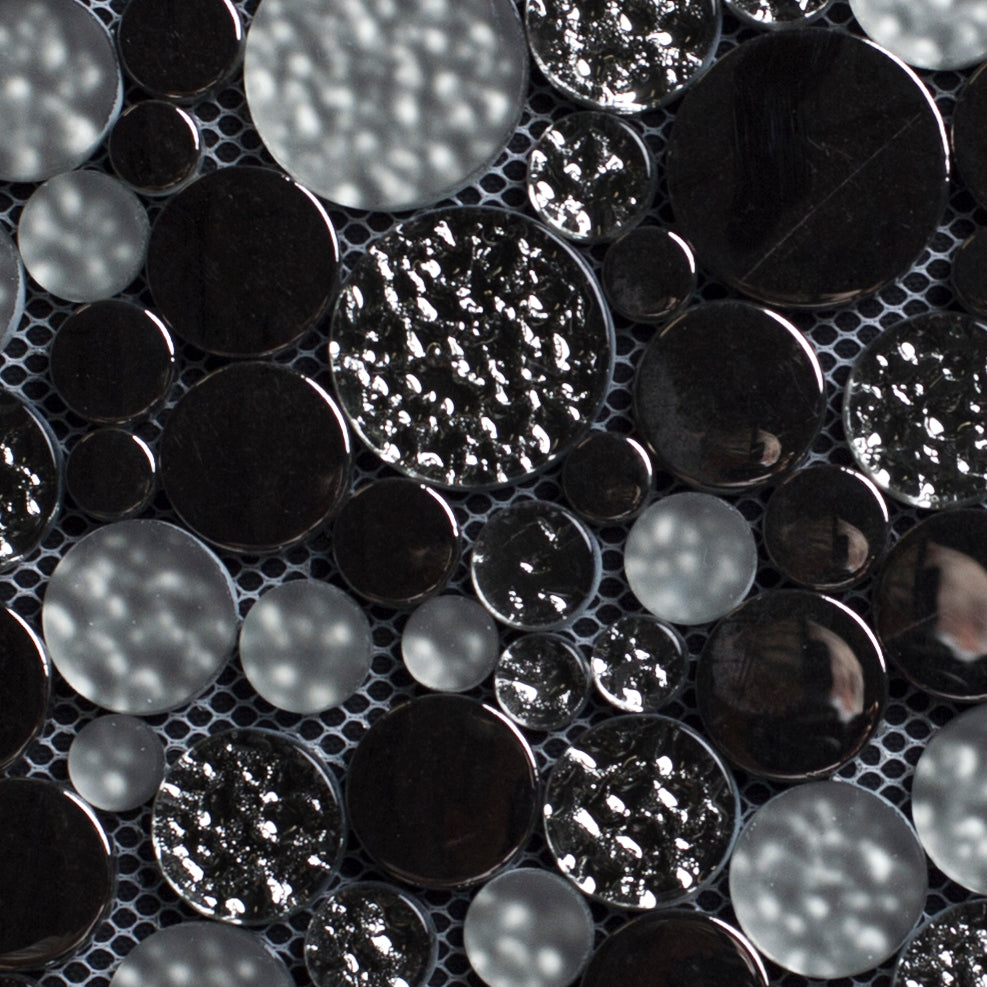 Close-up of black and gray circular tiles with a textured pattern