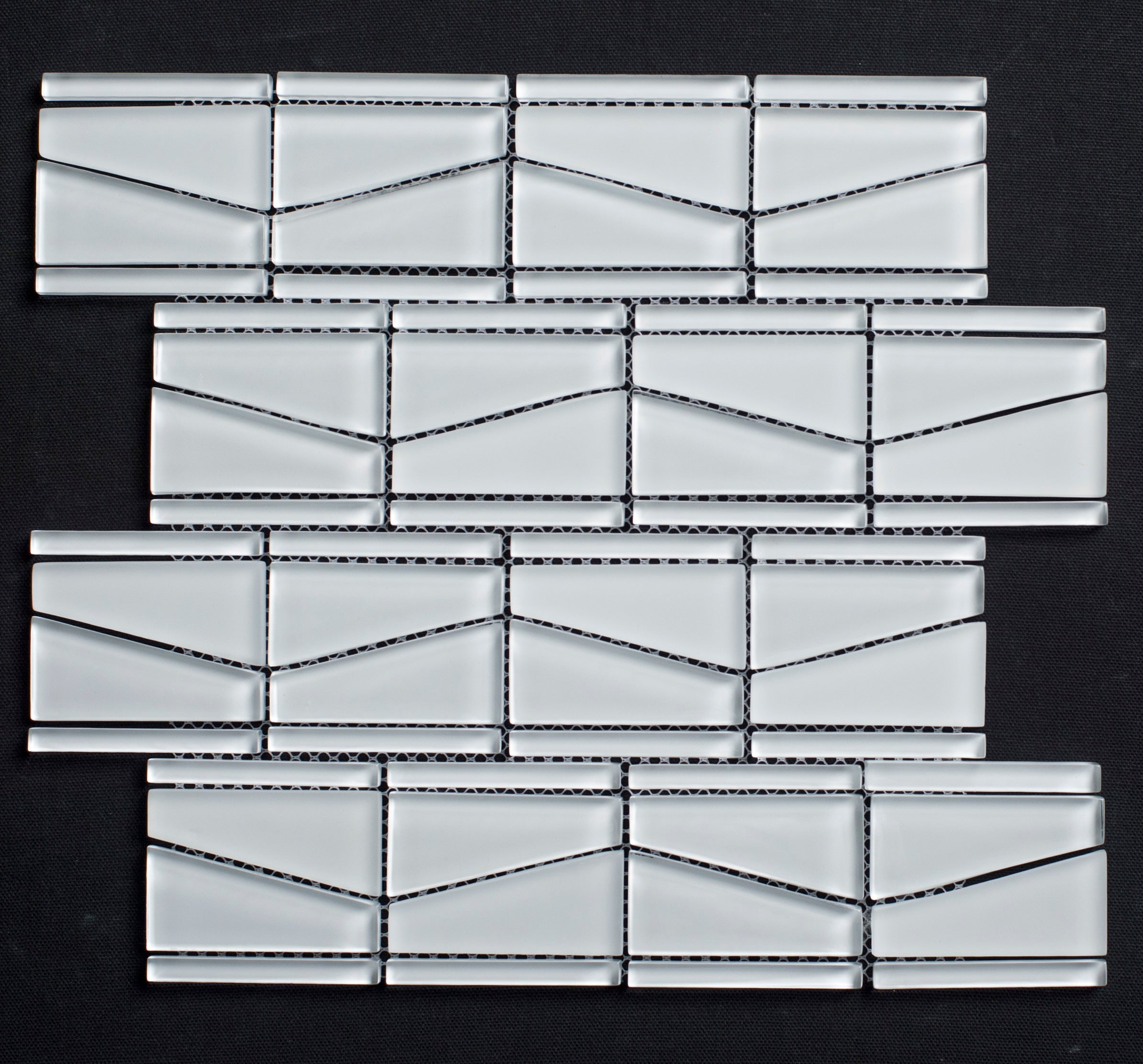 Glass mosaic tile pattern on a black background