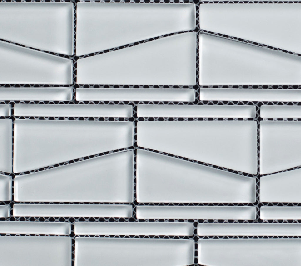 Mosaic pattern of rectangular tiles with black grout lines on a white background