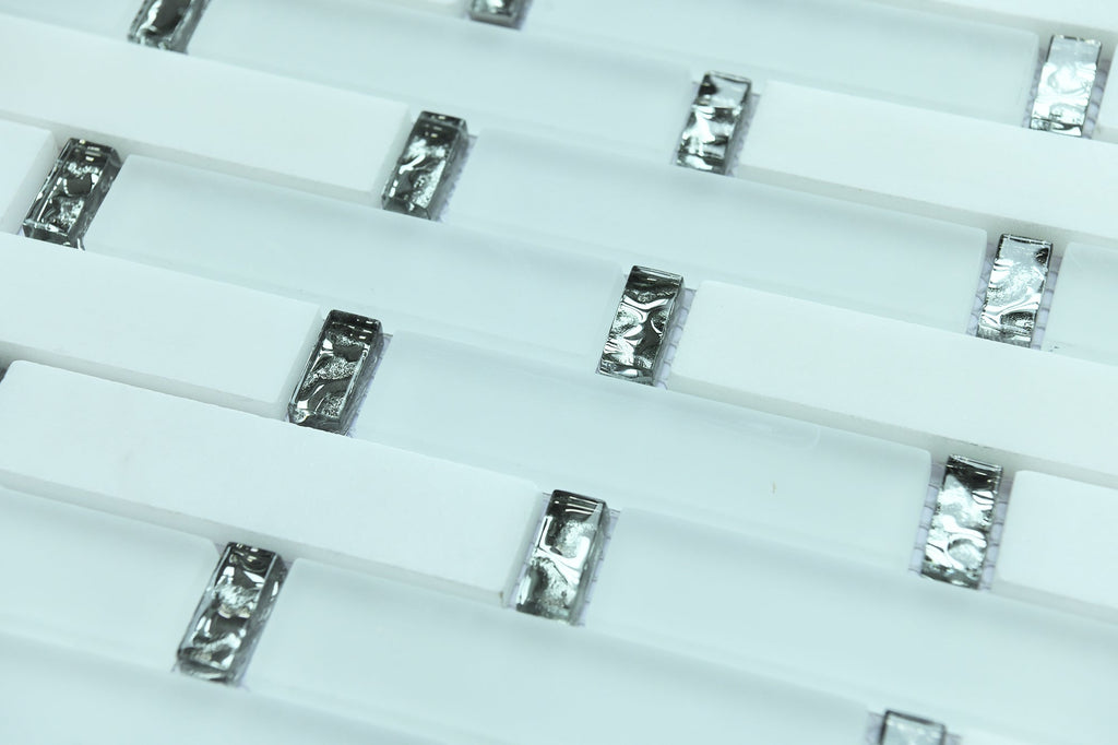 Close-up of small rectangular metallic objects on a white background