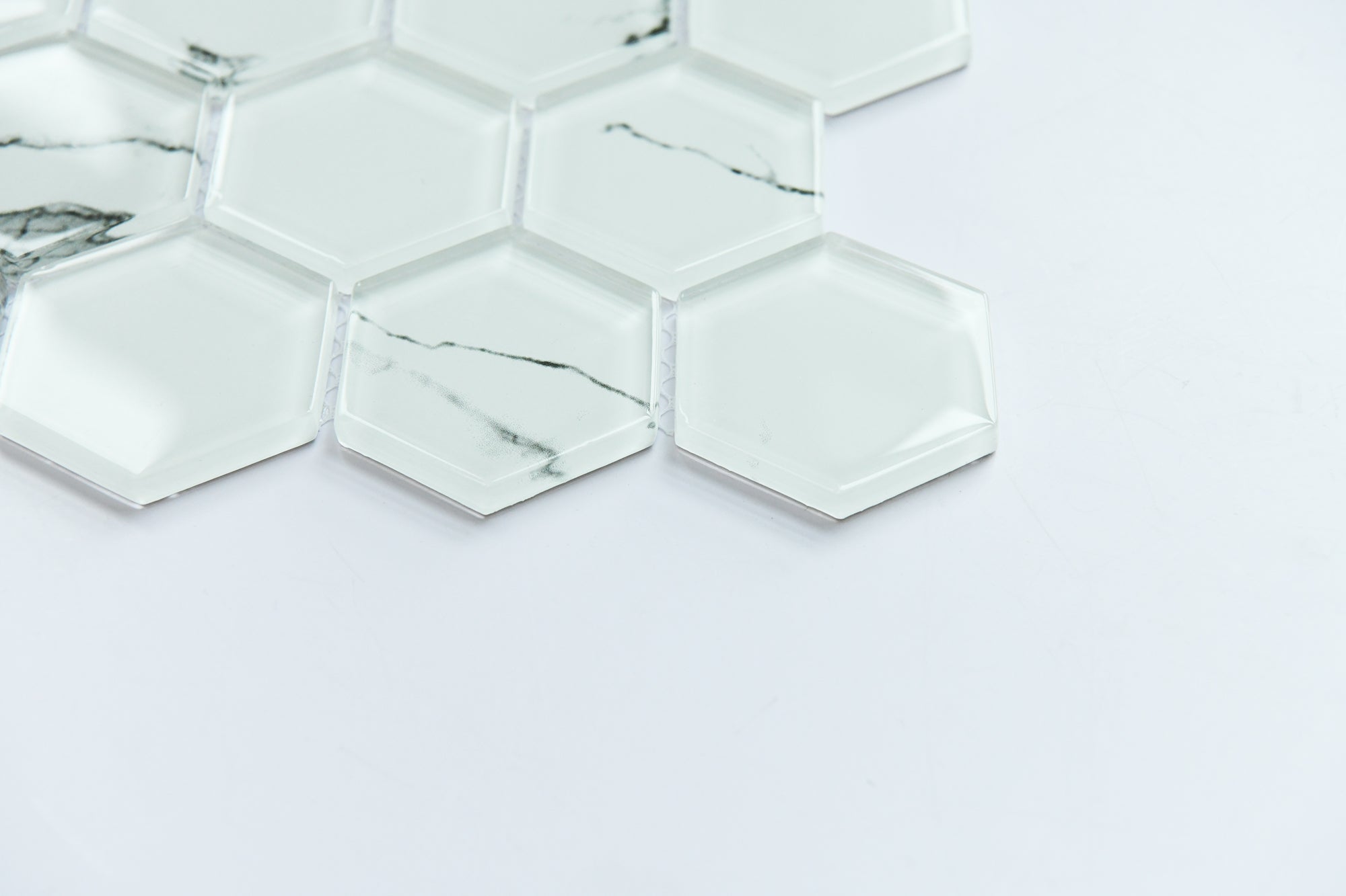 Hexagonal mirror tiles on a white background