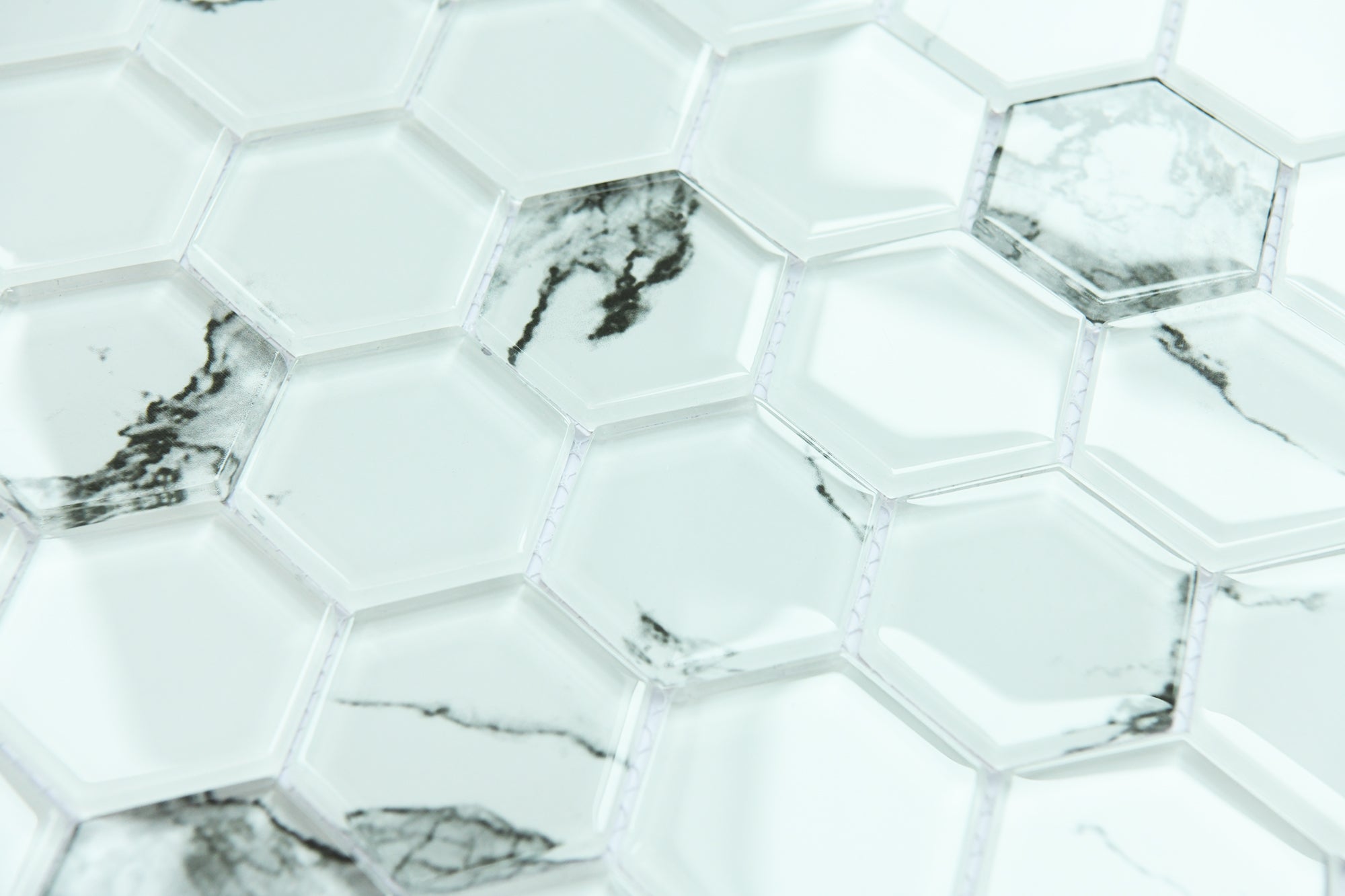 Hexagonal marble tiles with a white and gray pattern