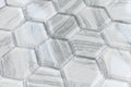 Close-up of hexagonal tile pattern with a metallic sheen