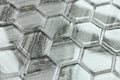 Close-up of hexagonal metallic tiles with a textured surface
