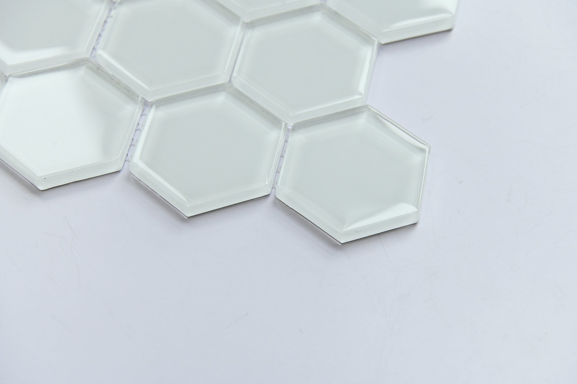 Hexagonal white tiles on a light gray background