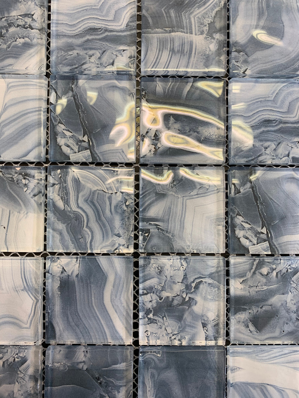 Patterned tiles with gray and white marbled design