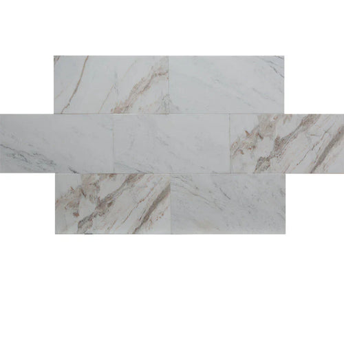 Calacatta Amber marble tile displaying soft white with flowing amber and taupe veining, perfect for elegant interiors.