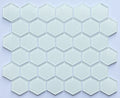 Hexagonal glass mosaic tiles on a light purple background