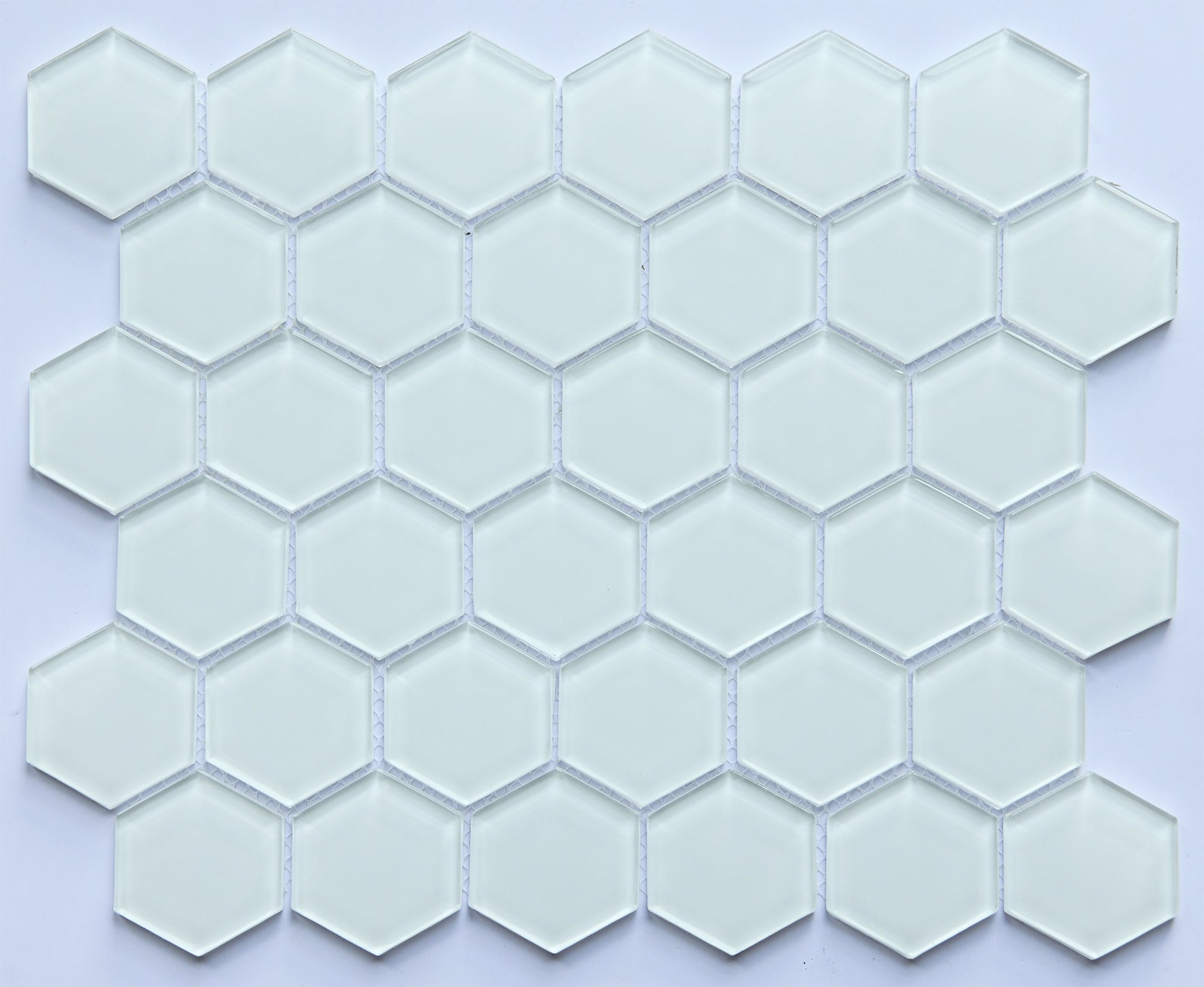 Hexagonal glass mosaic tiles on a light purple background