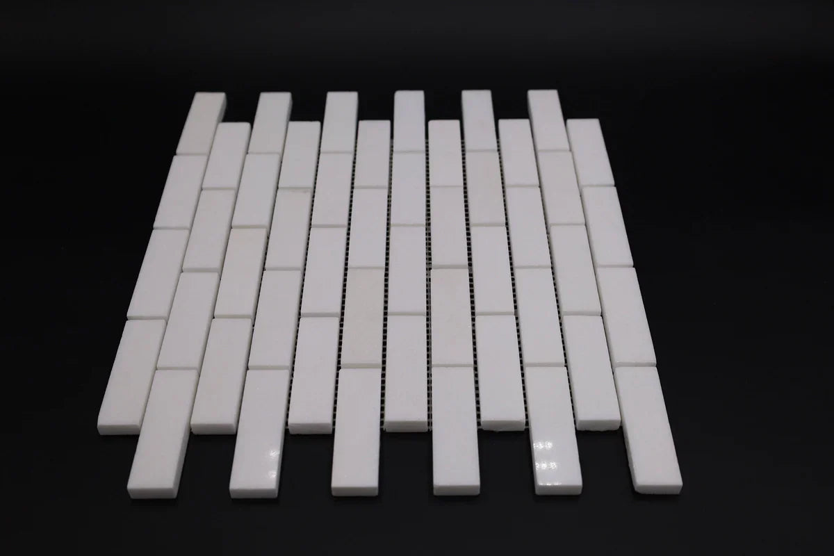 White ceramic mosaic tiles on a black background
